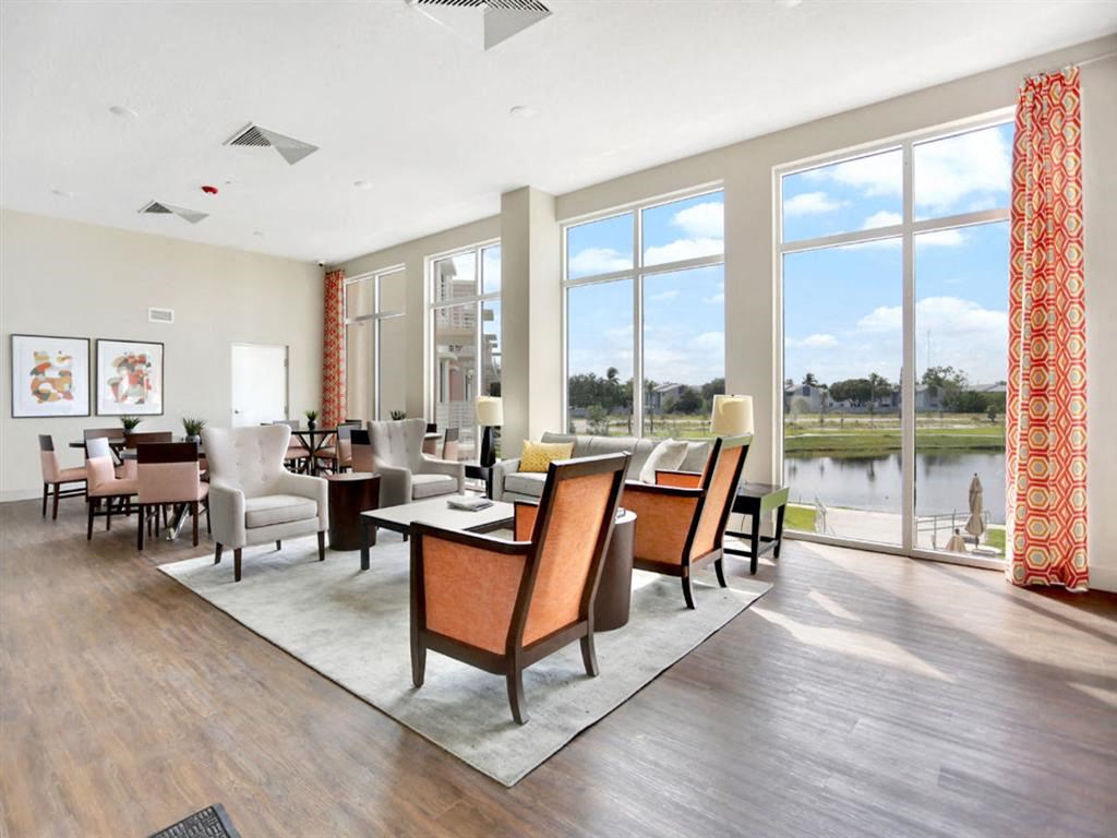 a living room with a view of a lake and a large window