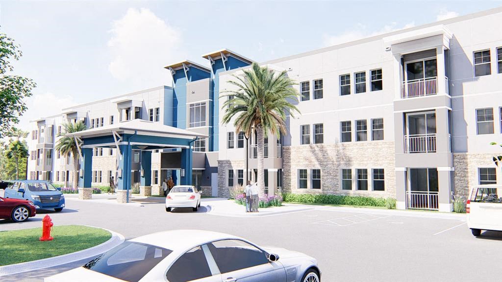 a large building with cars parked in front of it