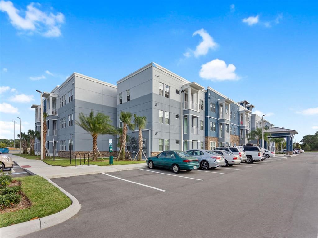 a building with cars parked in front of it