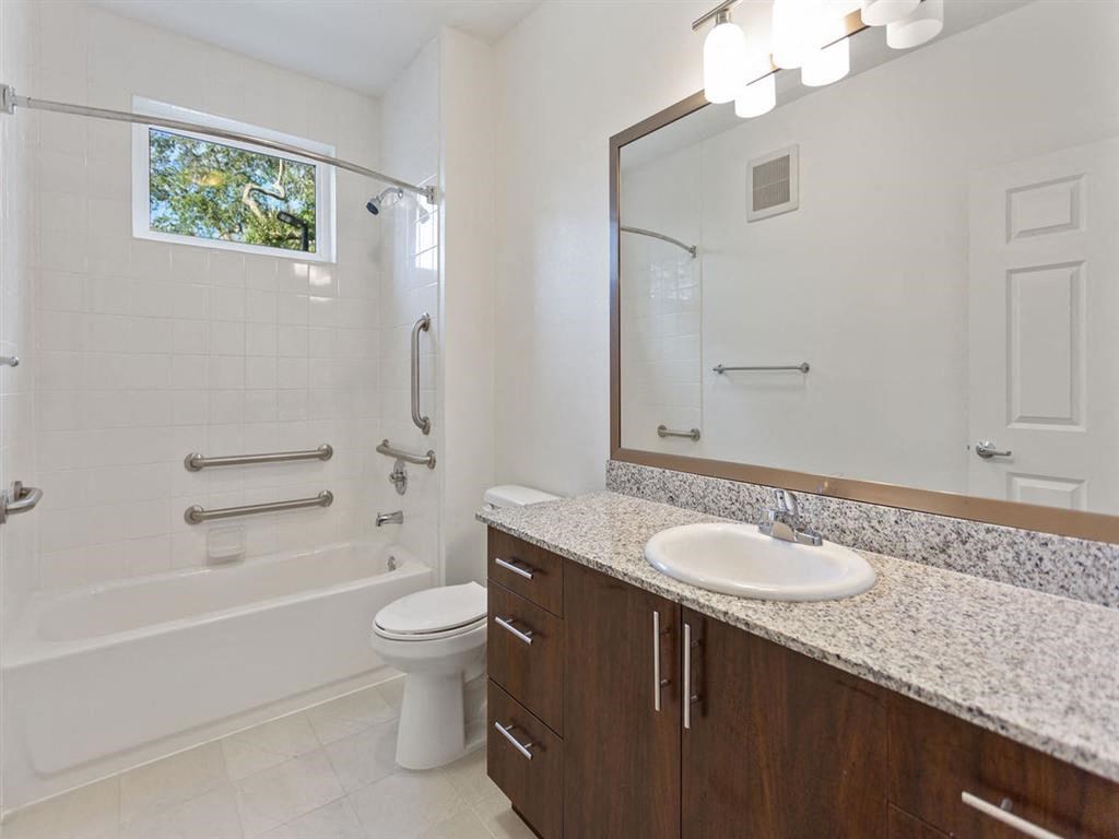 a bathroom with a sink toilet and a shower