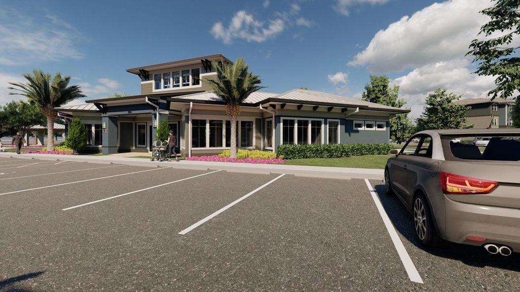 a house with a car parked in a parking lot