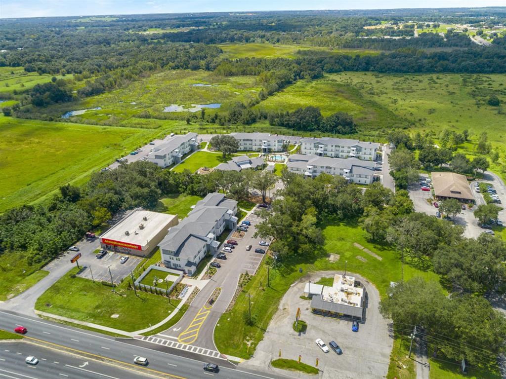 an aerial view of a city with buildings and a highway