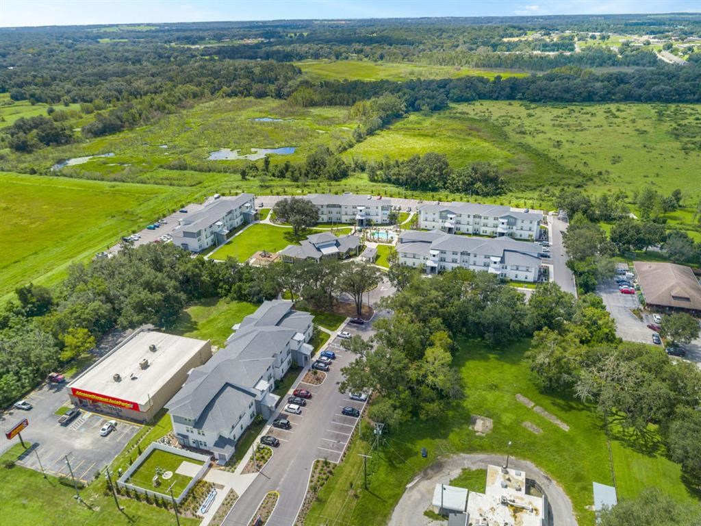 an aerial view of the campus and surrounding buildings and fields