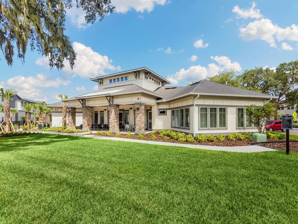 a large house with a lawn in front of it