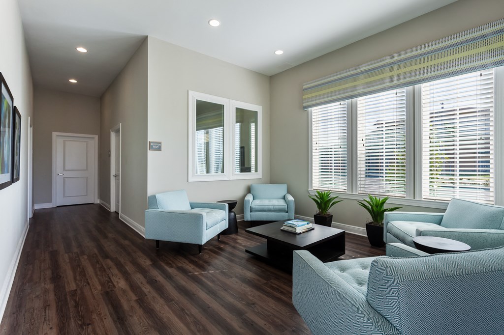 a living room with couches and chairs and a coffee table