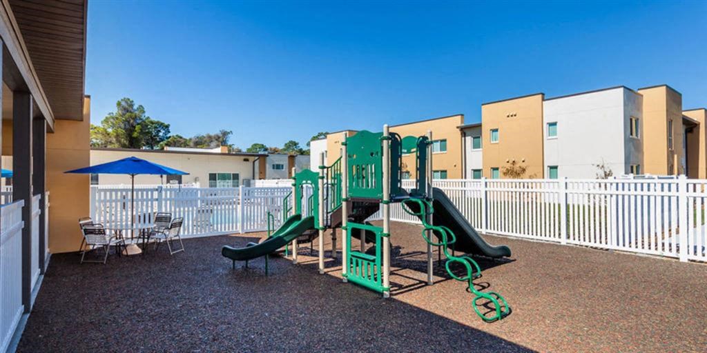our apartments have a playground with slides and a picnic table