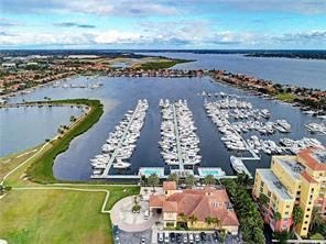 an aerial view of a harbor filled with boats