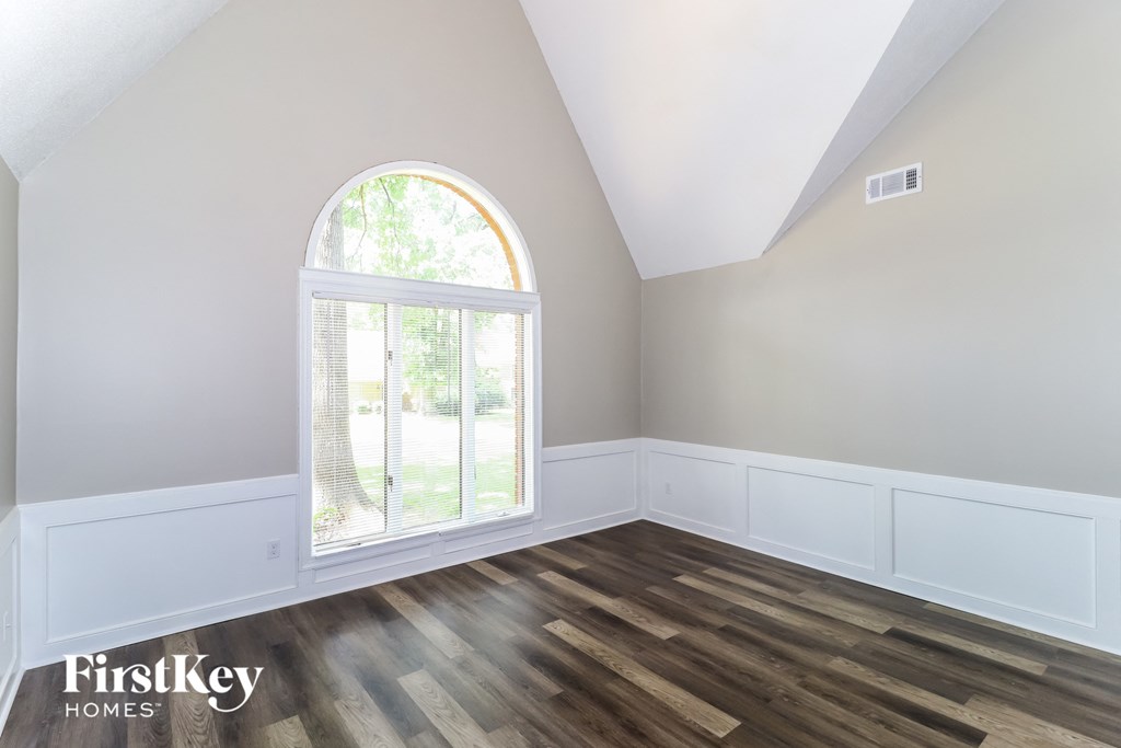 A room with a FirstKey HOMES logo on the bottom left corner.