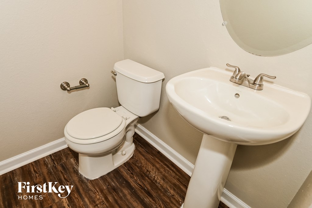 a bathroom with a toilet and a sink