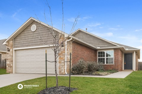 a house with a driveway and a garage door