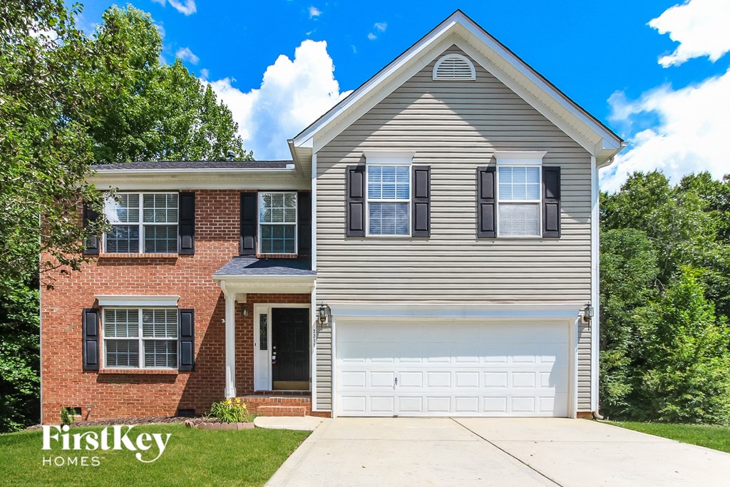 a suburban house with a white garage door