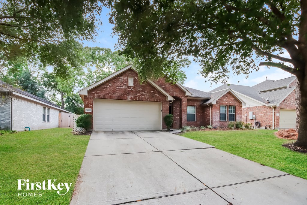 A house with a driveway in front of it.