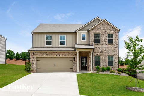 a large house with a garage door in front of it