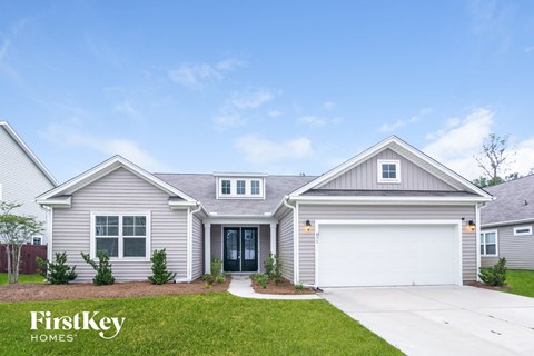 a beige and white house with a garage door