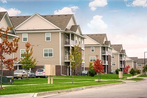 a row of houses on the side of a street