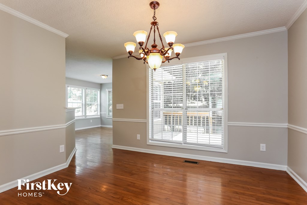 the dining room is open to the kitchen and living room