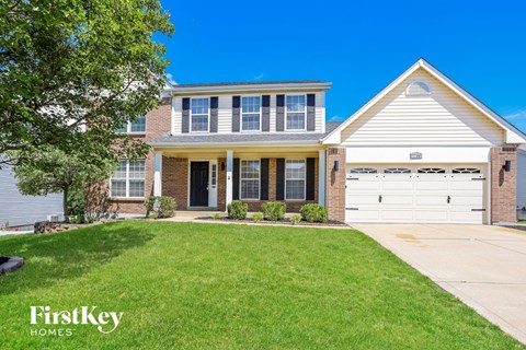 a large house with a lawn in front of it