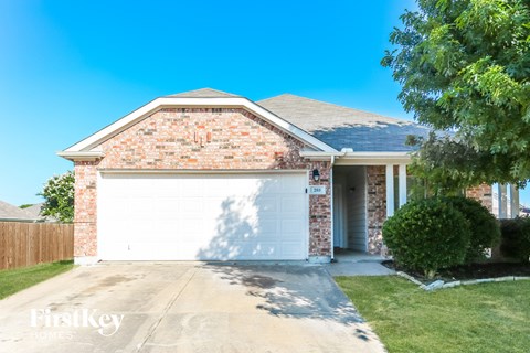 a brick house with a white garage door