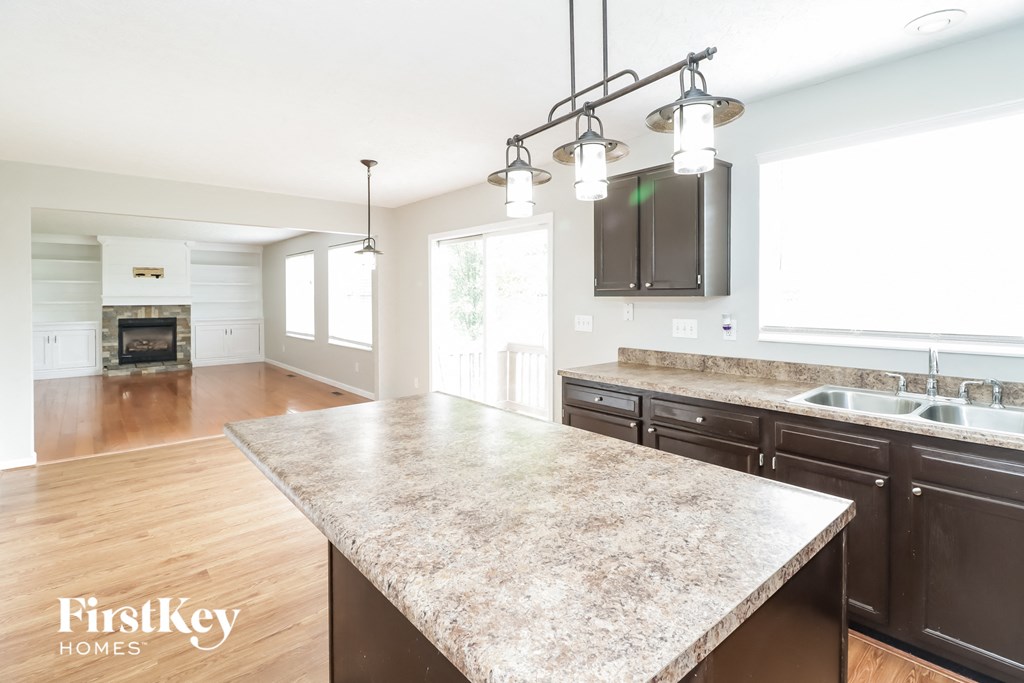 a kitchen with a marble counter top and a large island