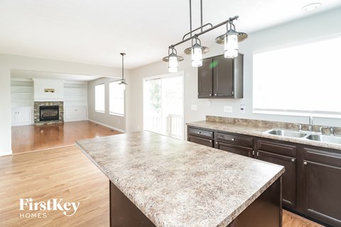 a kitchen with a marble counter top and a large island
