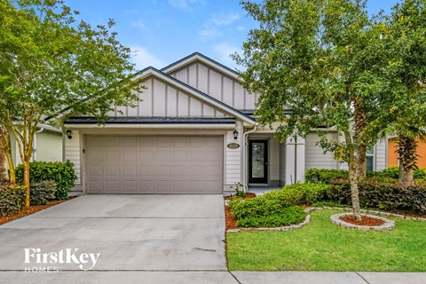 a home with a driveway and a garage door
