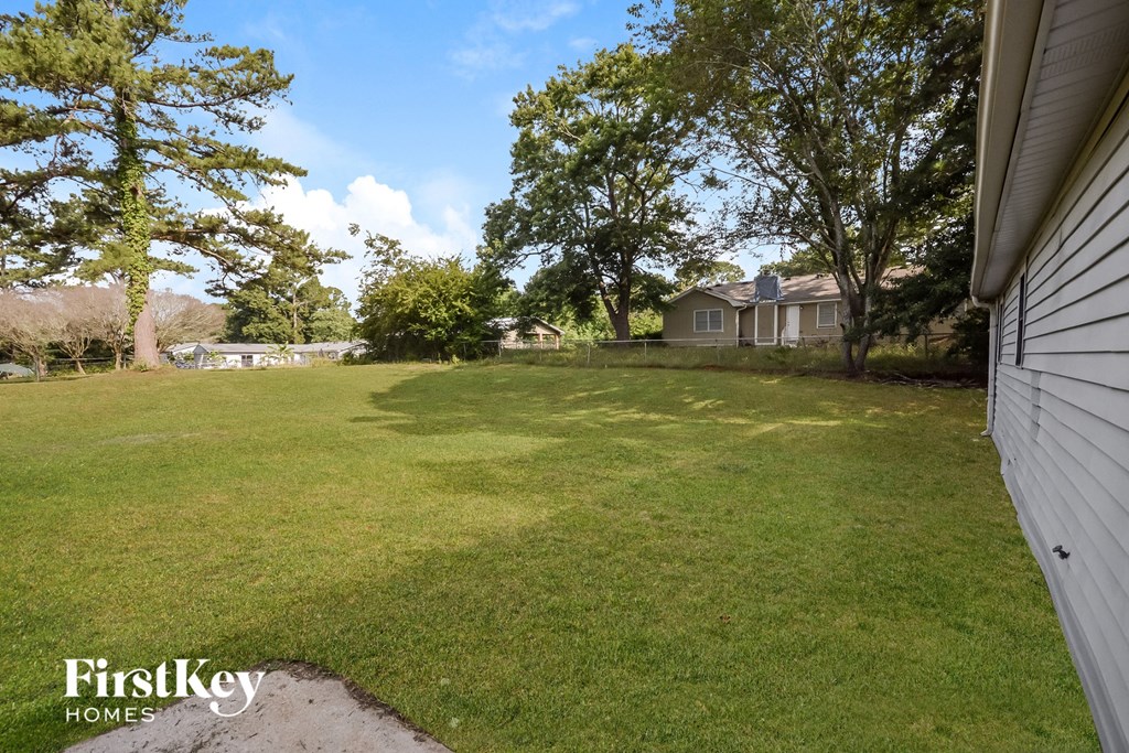 a view of the backyard from the side of the house