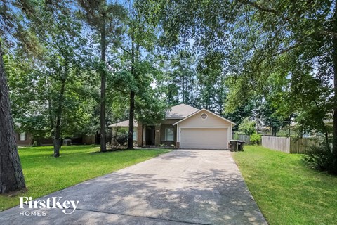 a home with a driveway and a garage door