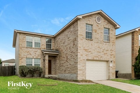 a brick house with a white garage door