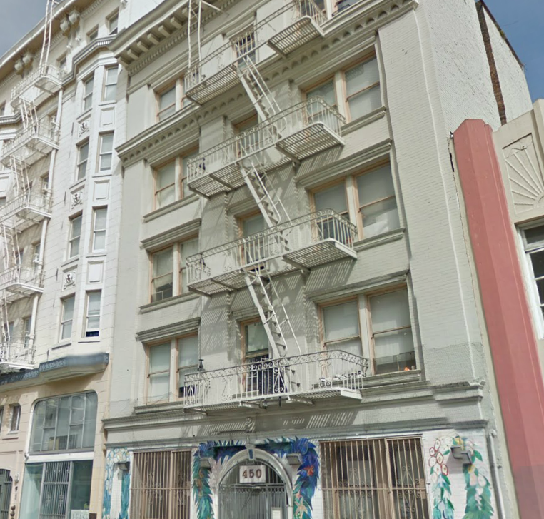 A building with a fire escape on the side.