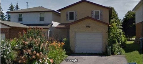 a house with a garage door in front of it