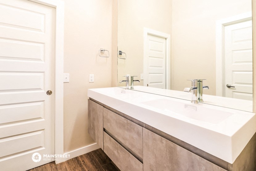 a bathroom with a sink and a mirror