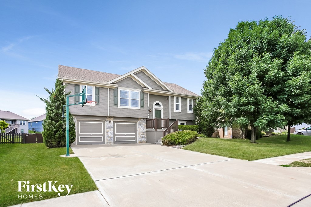 a house with a driveway and a garage door