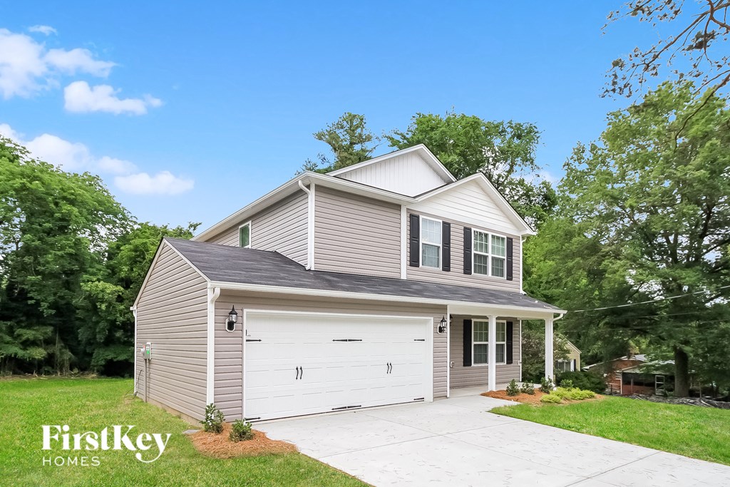 a home with a garage and a white garage door