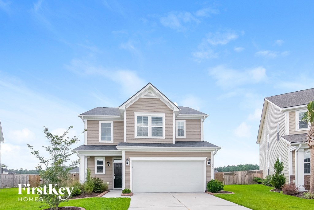 A house with a garage is for sale by FirstKey Homes.