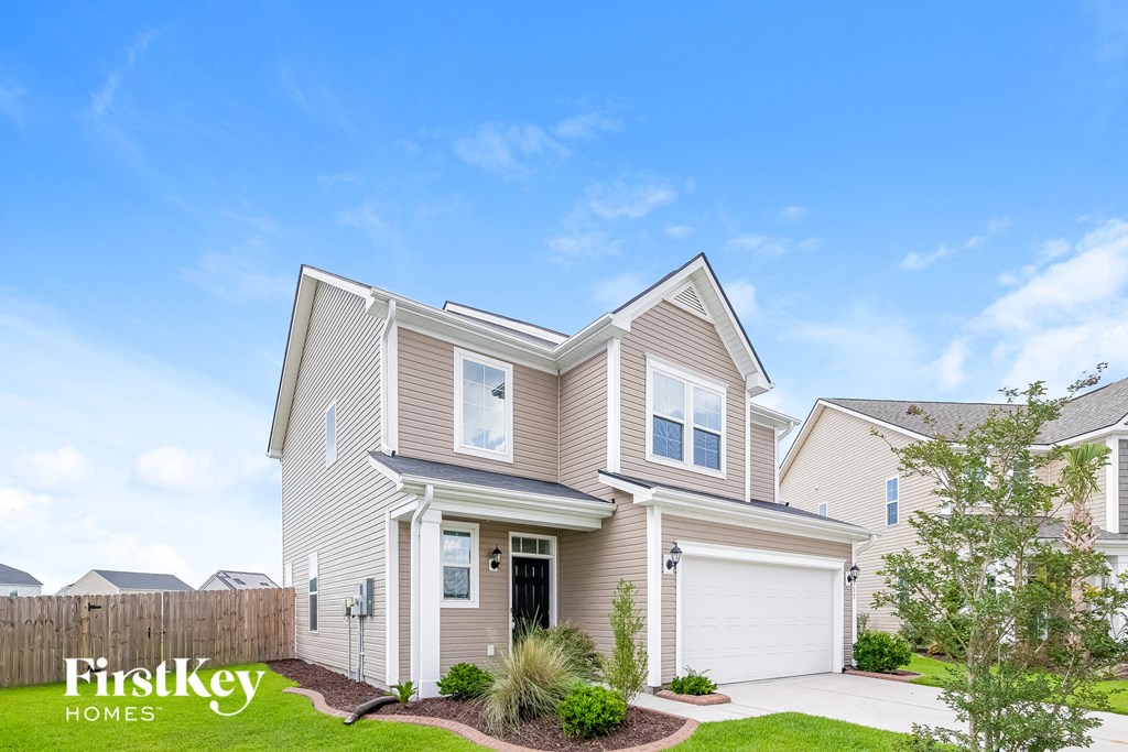 A house with a clear blue sky in the background.