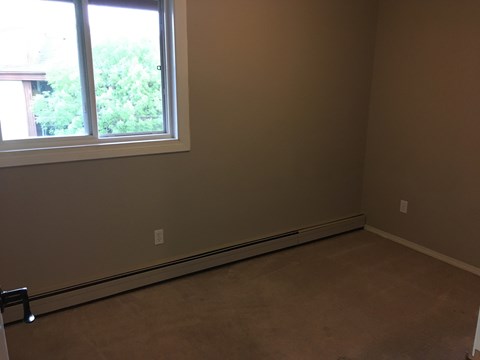 an empty room with a large window in it