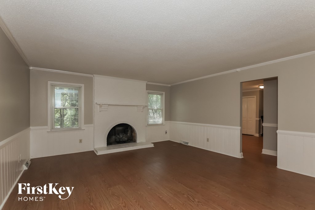 the living room of a house with a fireplace