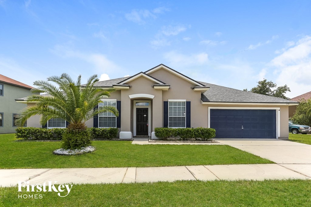a house with a palm tree in front of it