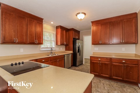 a kitchen with wooden cabinets and a counter top