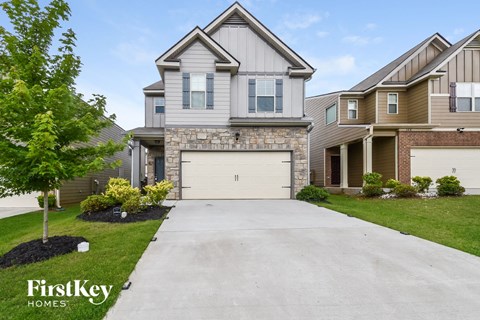 A house with a garage is for sale by FirstKey Homes.