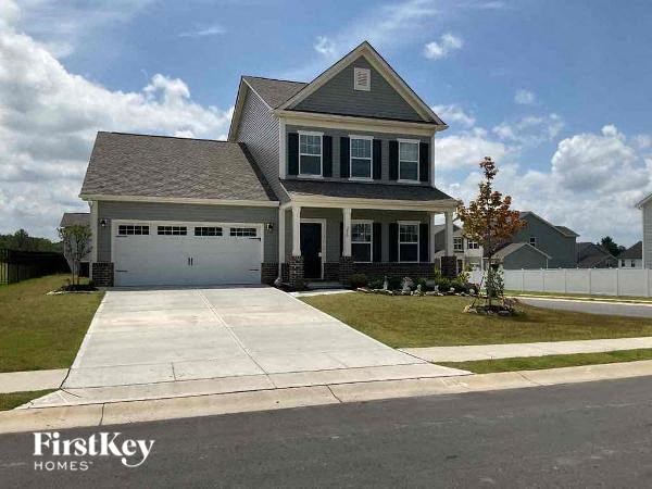 a house with a driveway and a garage door