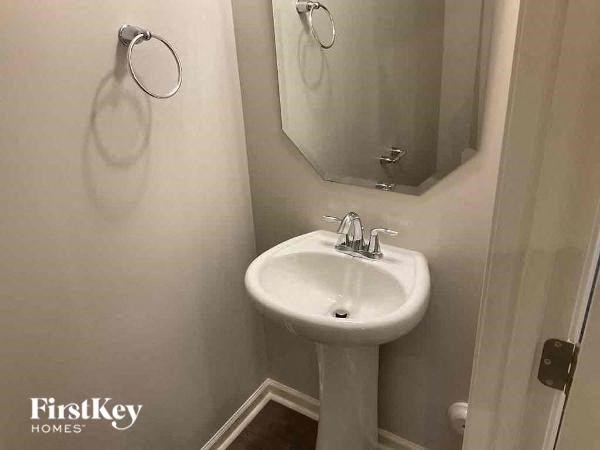 a small bathroom with a sink and a mirror