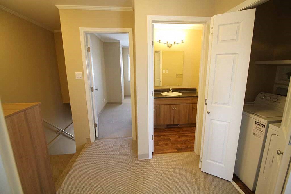 a kitchen and a bathroom with a sink and a toilet