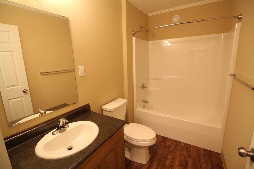 a bathroom with a sink toilet and a shower