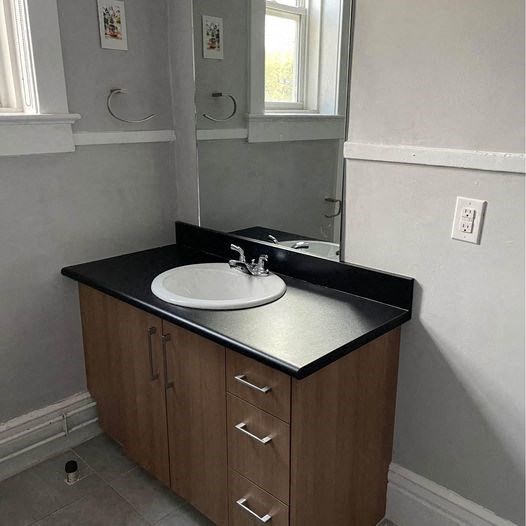 a bathroom with a sink and a mirror