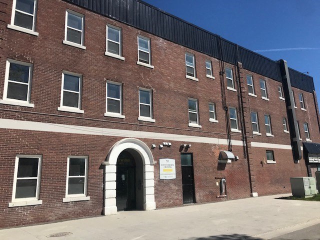a brick building with an arched door