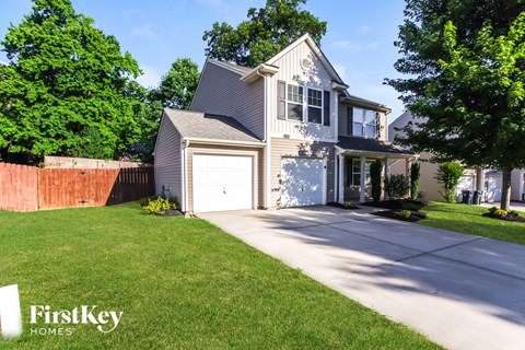 A house with a garage is for sale by FirstKey Homes.