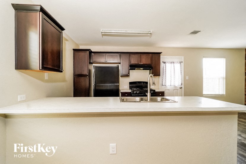 a kitchen with a counter top and a sink