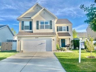 a white house with a white garage door