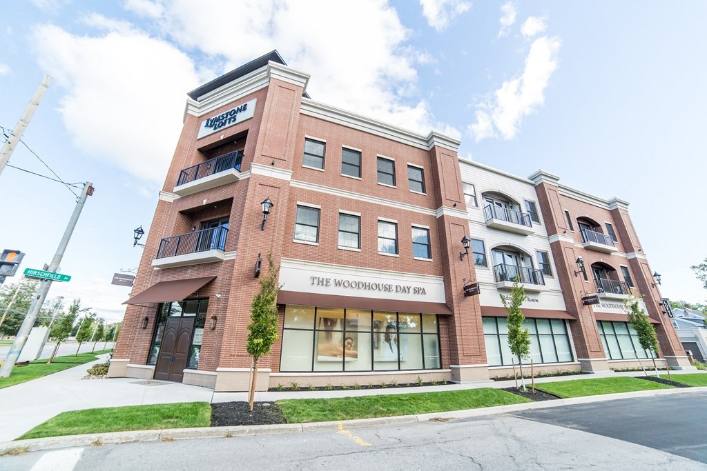 a brick building with a sign that reads the moderne bar at the corner of